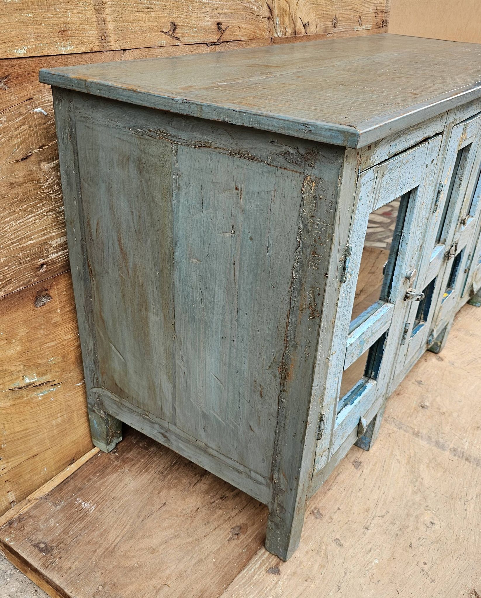 Antique glass-fronted buffet in Burmese teak