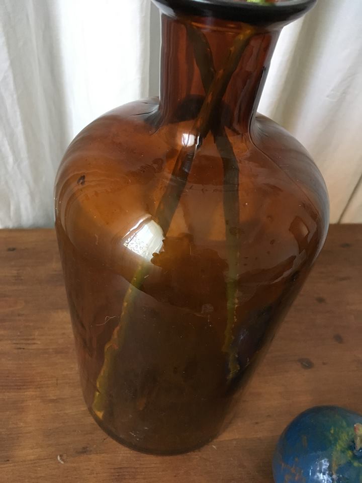 Old thick glass amber bottle