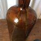 Old thick glass amber bottle