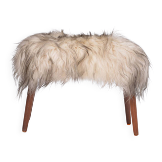 Danish Mid-century Modern stool reupholstered in white and black sheep skin