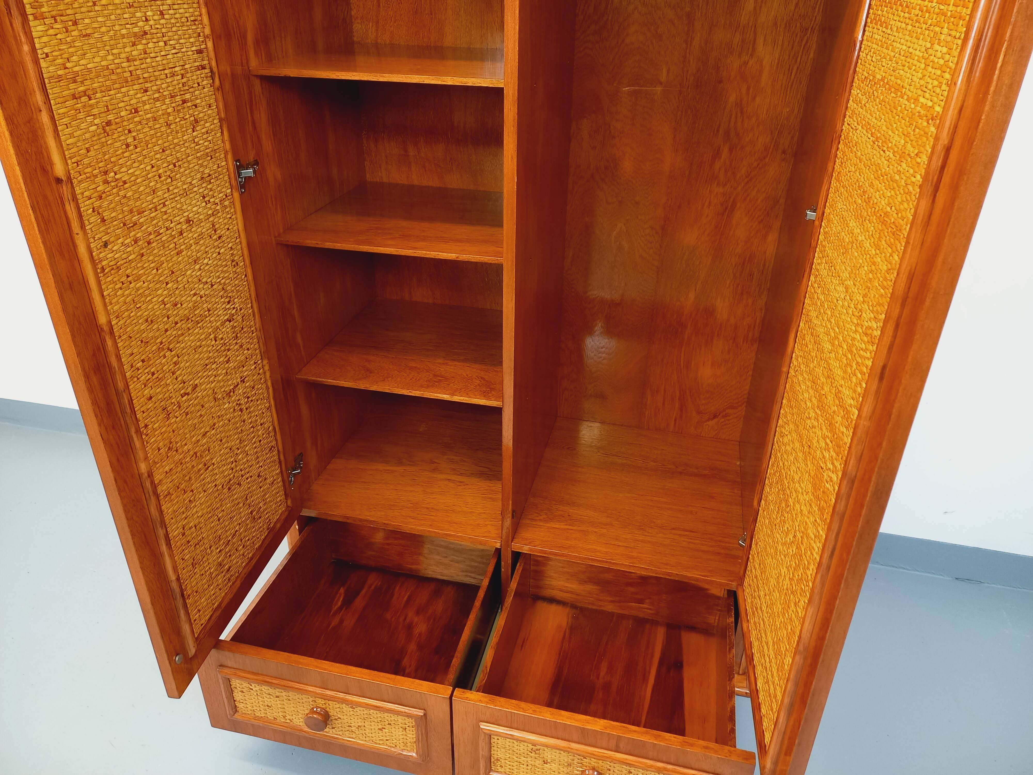 Vintage woven rattan and wood armoire by Maugrion for Roche-Bobois.