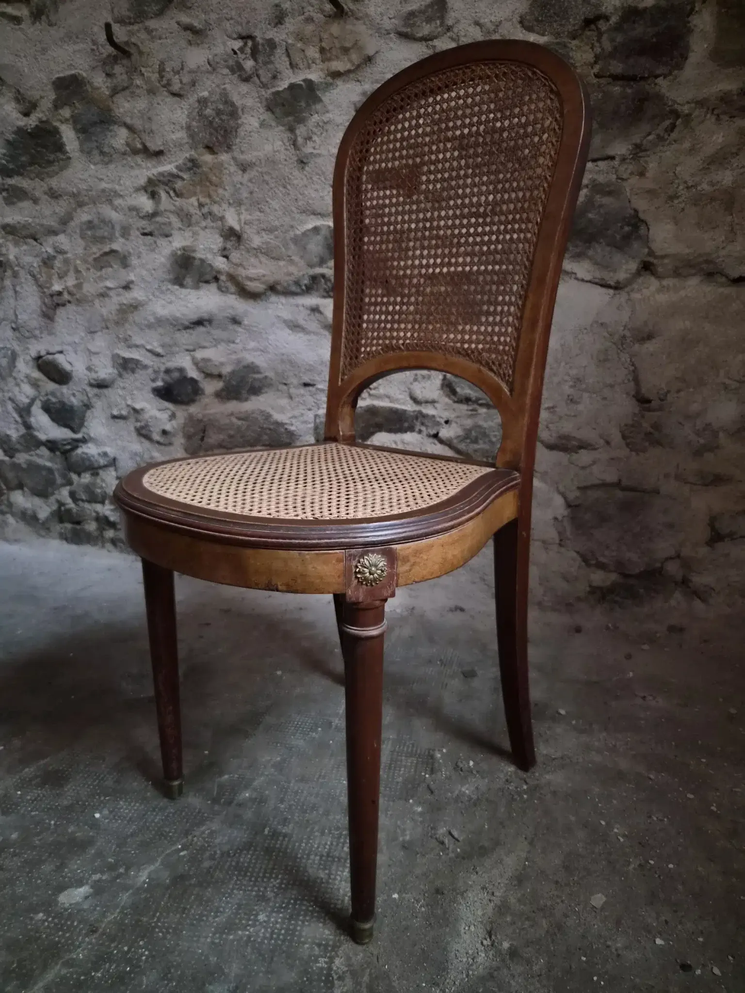Set of 6 antique Louis XVI style dining chairs with caning.