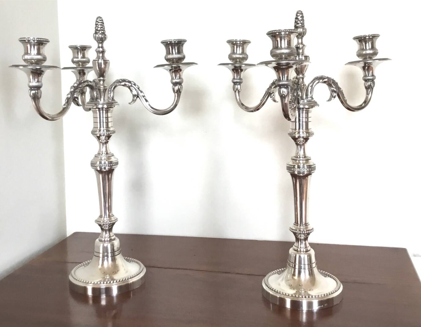 Pair of Louis XVI style silver-plated metal candelabras. Chrysalia house