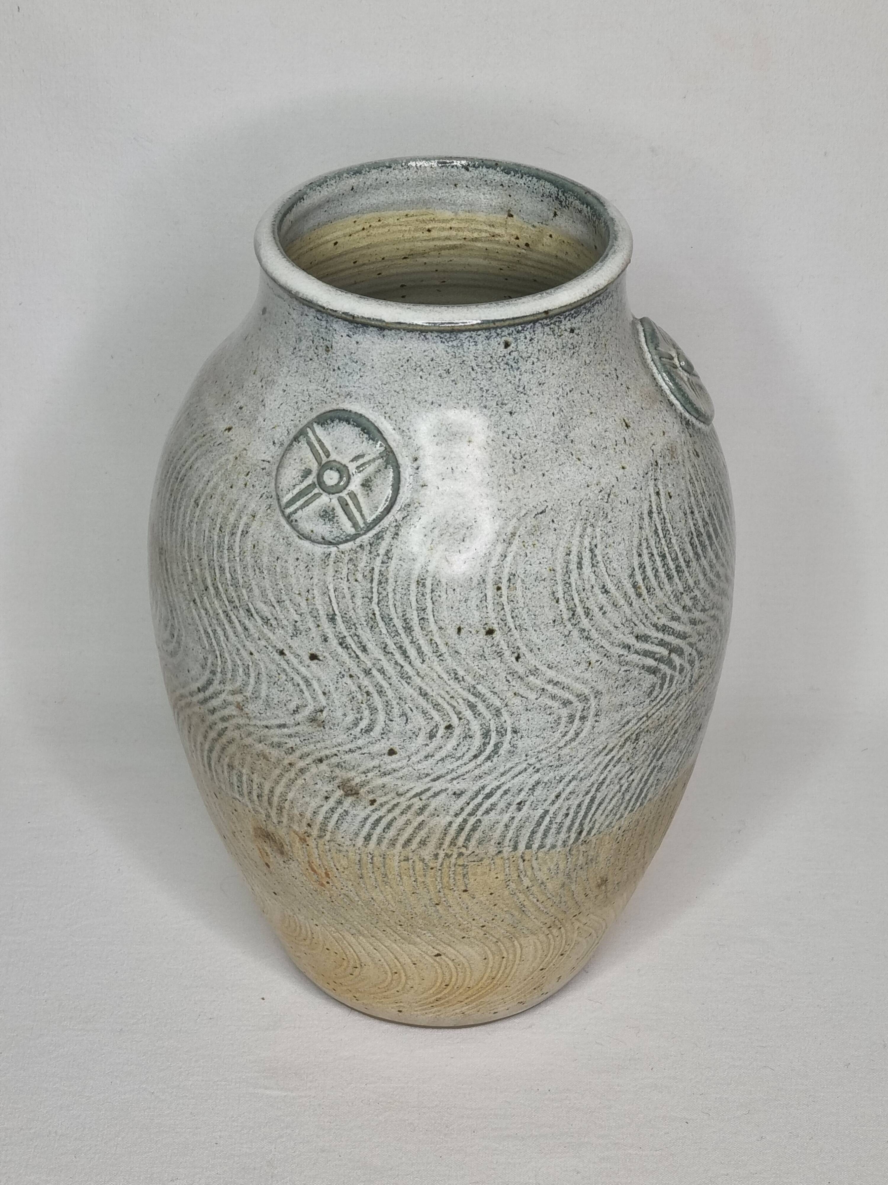 Stoneware vase signed by Sylvie Dufour, incised decoration and relief medallions, 28 cm.