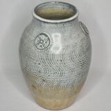 Stoneware vase signed by Sylvie Dufour, incised decoration and relief medallions, 28 cm.