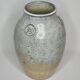Stoneware vase signed by Sylvie Dufour, incised decoration and relief medallions, 28 cm.