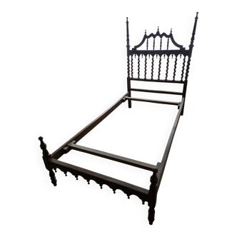 Carved wooden half-canopy bed