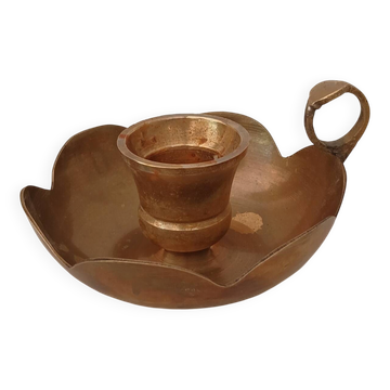 Brass candle holder in the shape of a flower.
