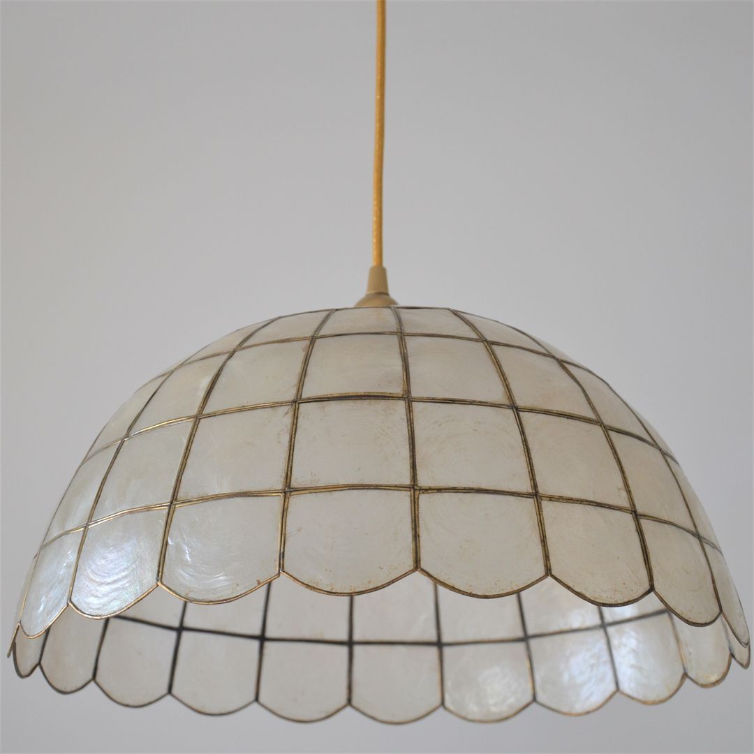 Mother-of-pearl and brass suspension