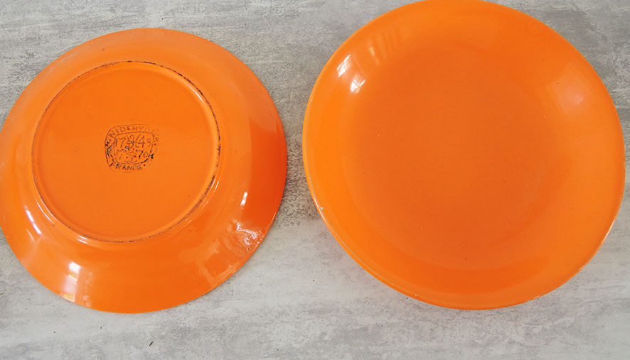 10 Niderviller hollow plates in orange earthenware