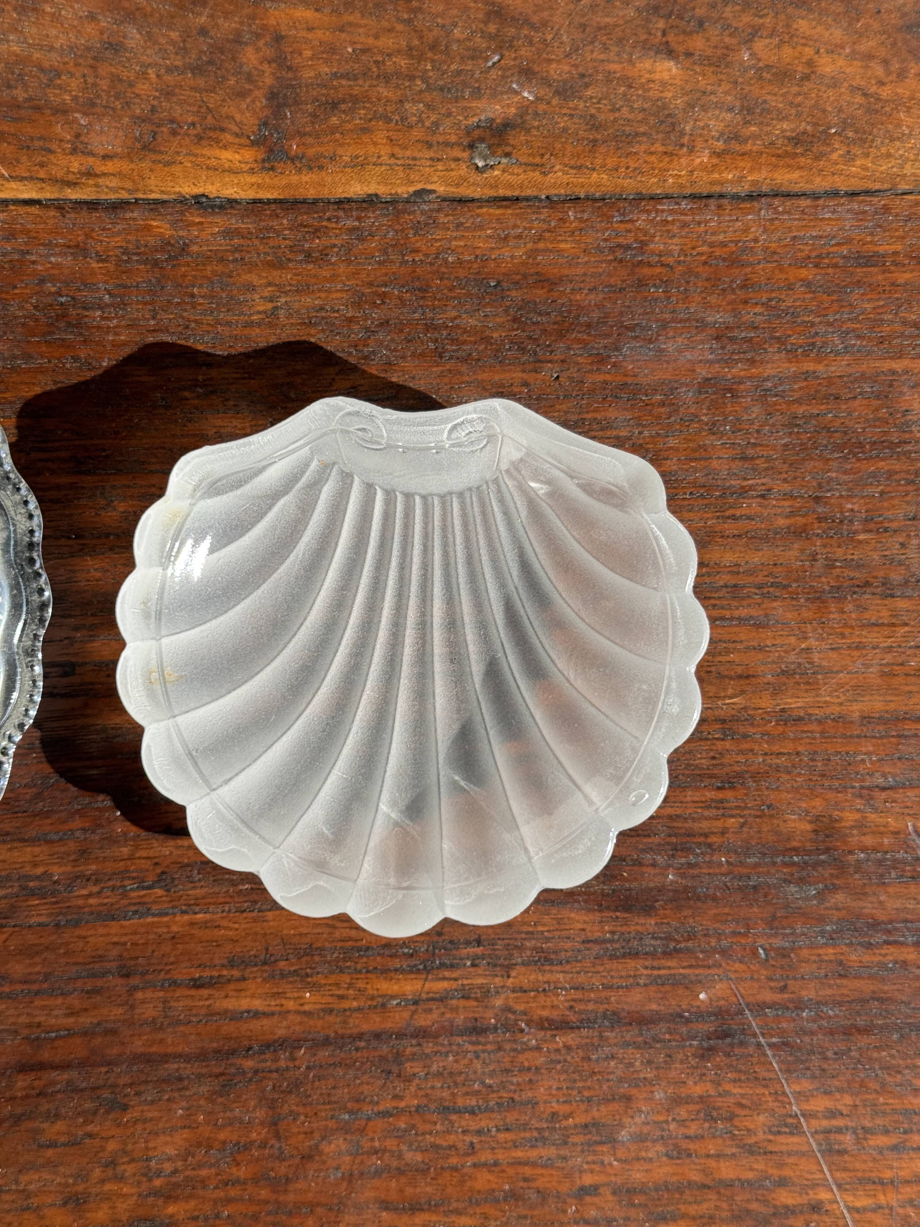 Vintage silver-plated shell butter dish with transparent bowl.