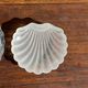 Vintage silver-plated shell butter dish with transparent bowl.