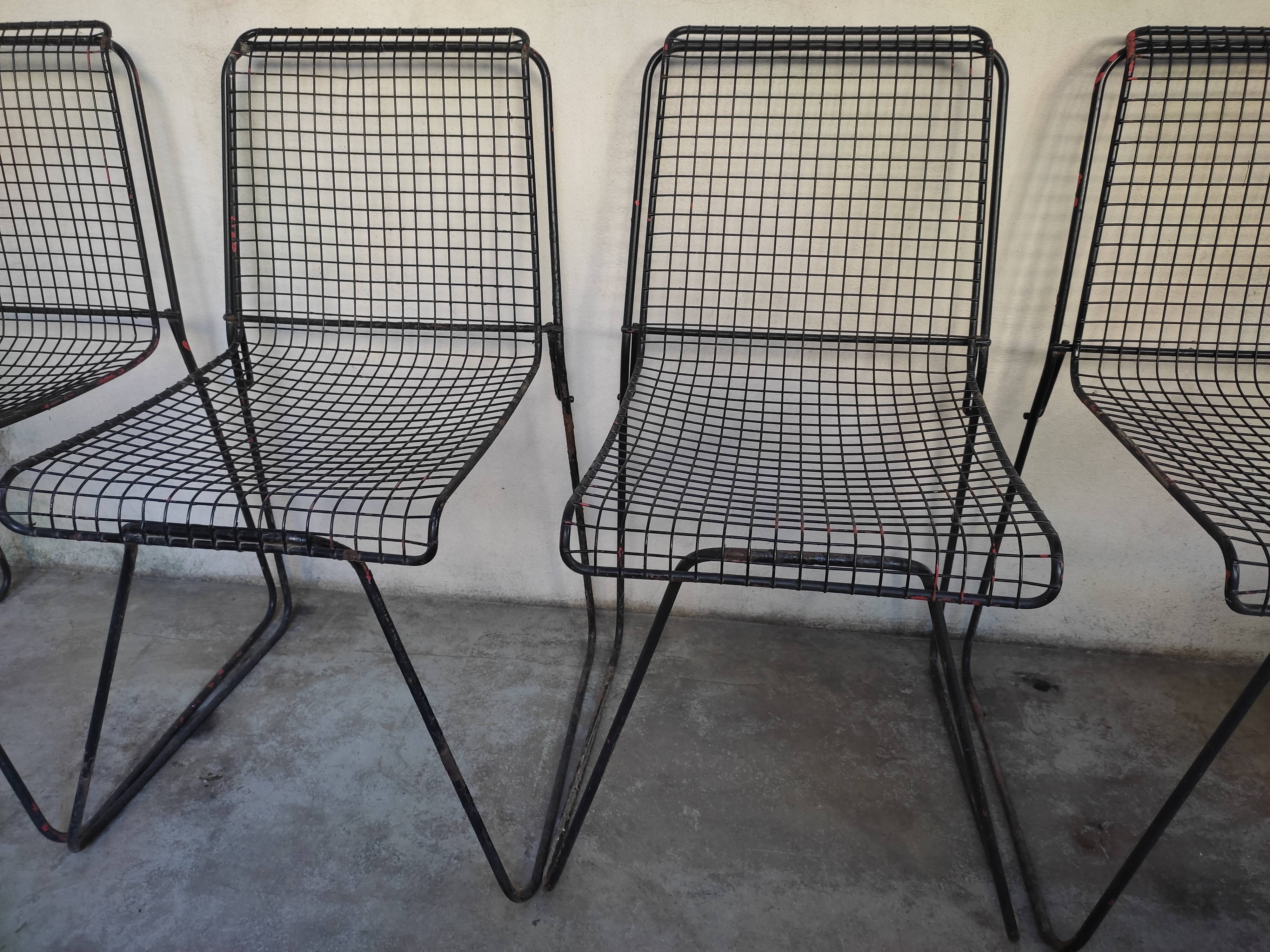 4 gridded metal chairs
