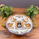 Handled coupe in Gien earthenware with heraldic and fantastic decoration.