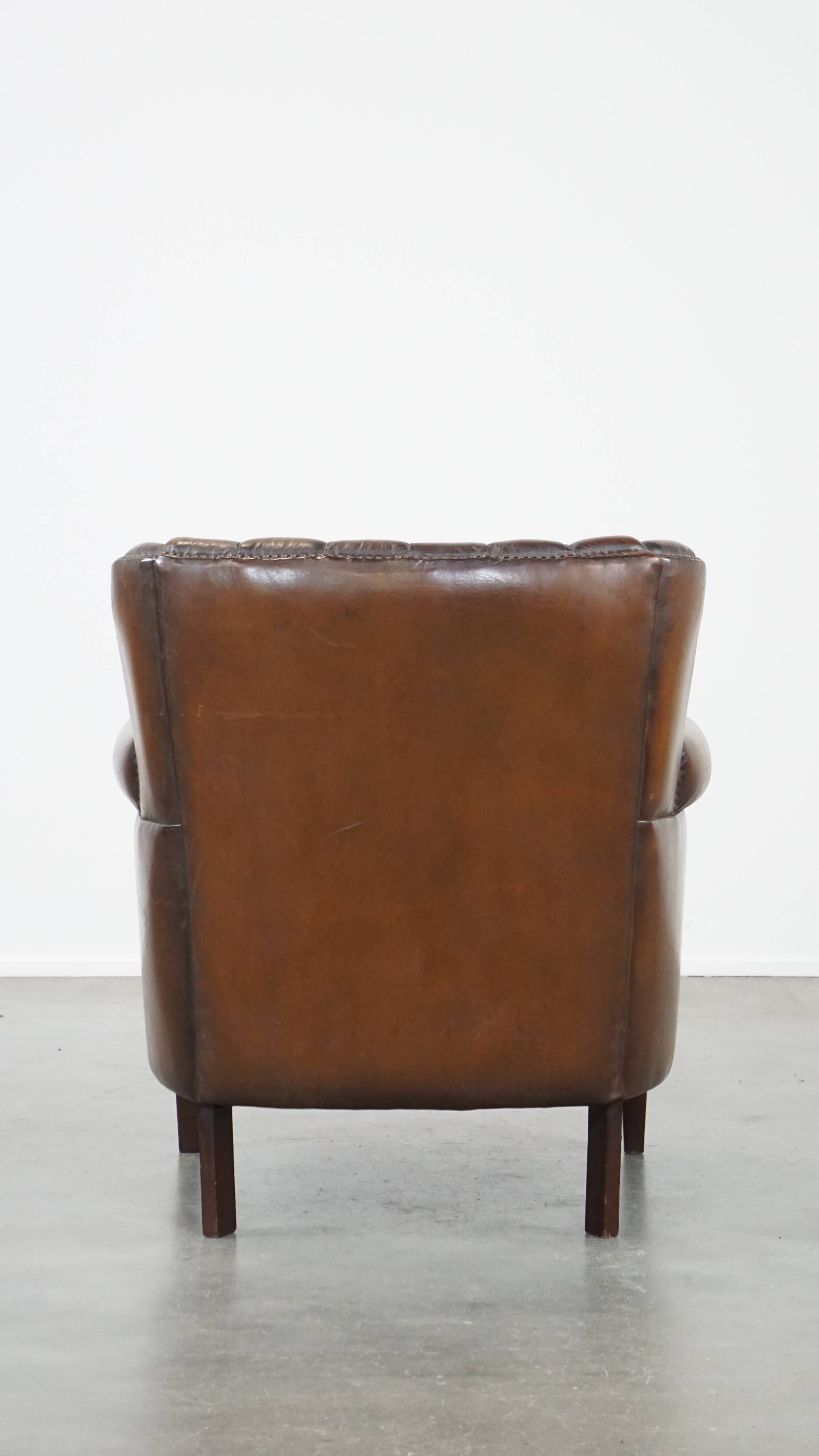 Sheep leather armchair finished with decorative nails