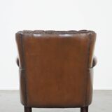 Sheep leather armchair finished with decorative nails