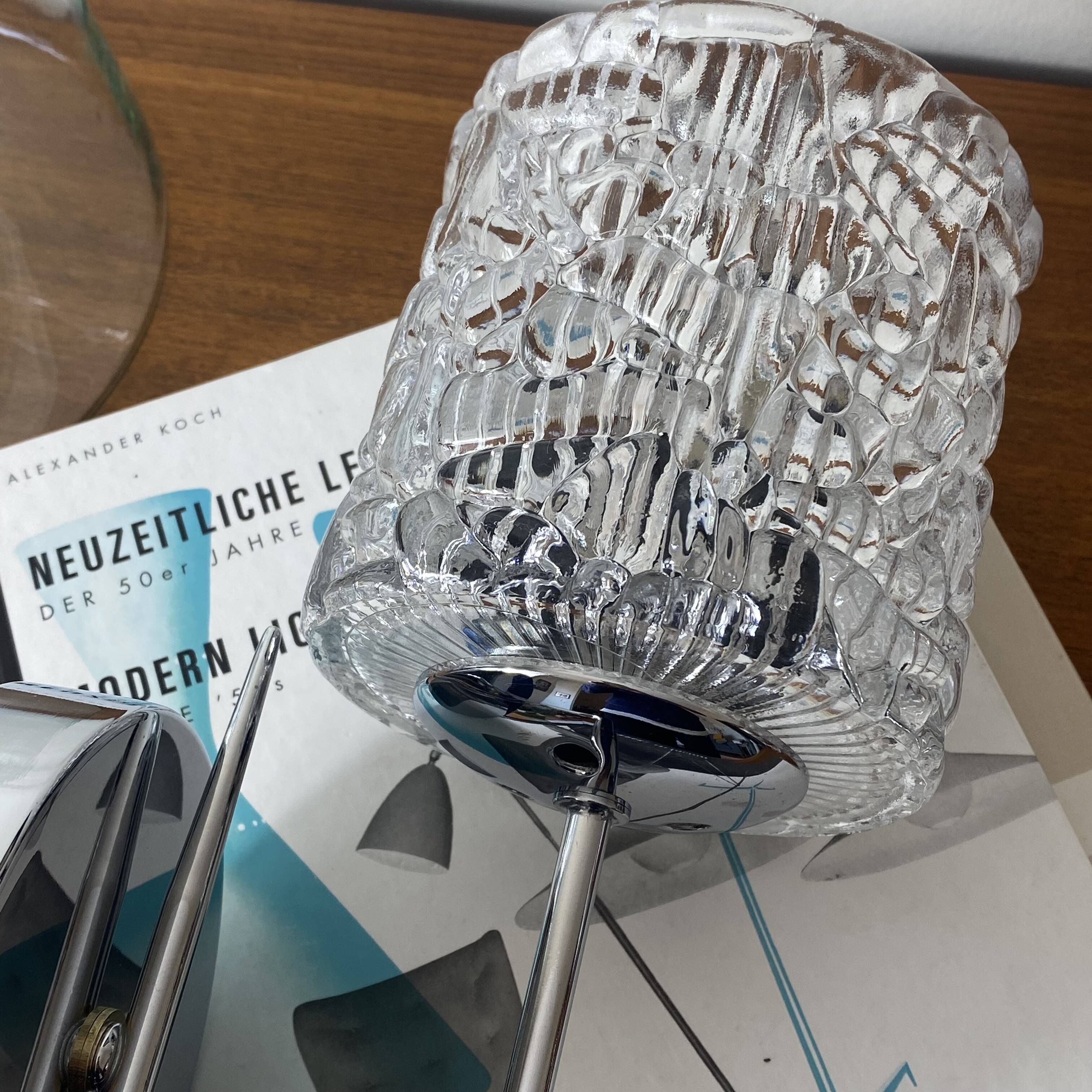 Swan neck wall light in stainless steel, thick glass shade, stainless steel rose.