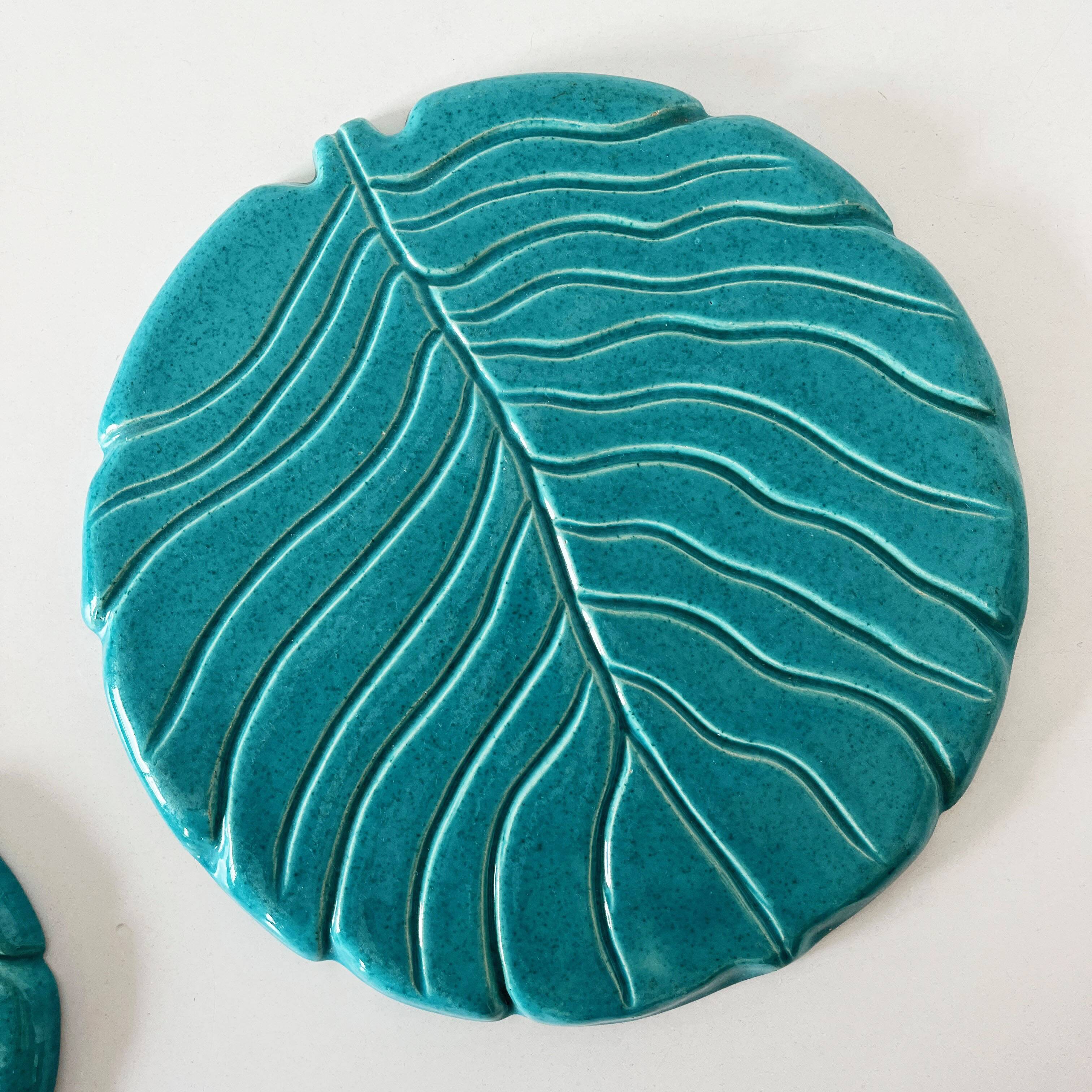 Ceramic trivet and bottle coaster from the 1950s.