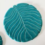 Ceramic trivet and bottle coaster from the 1950s.