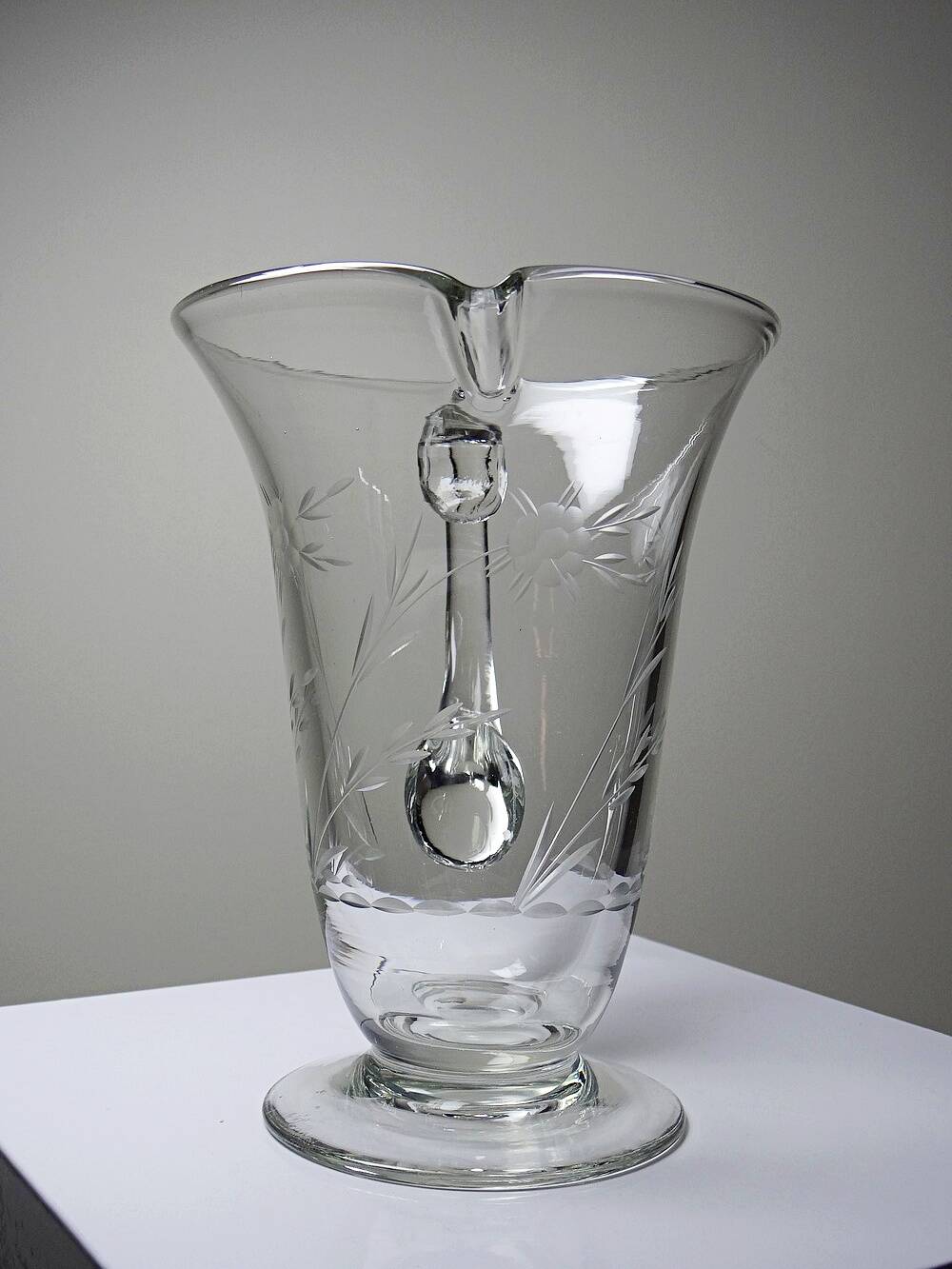 Antique glass pitcher with wheel engraving and floral decoration, Bohemia, early 20th century.