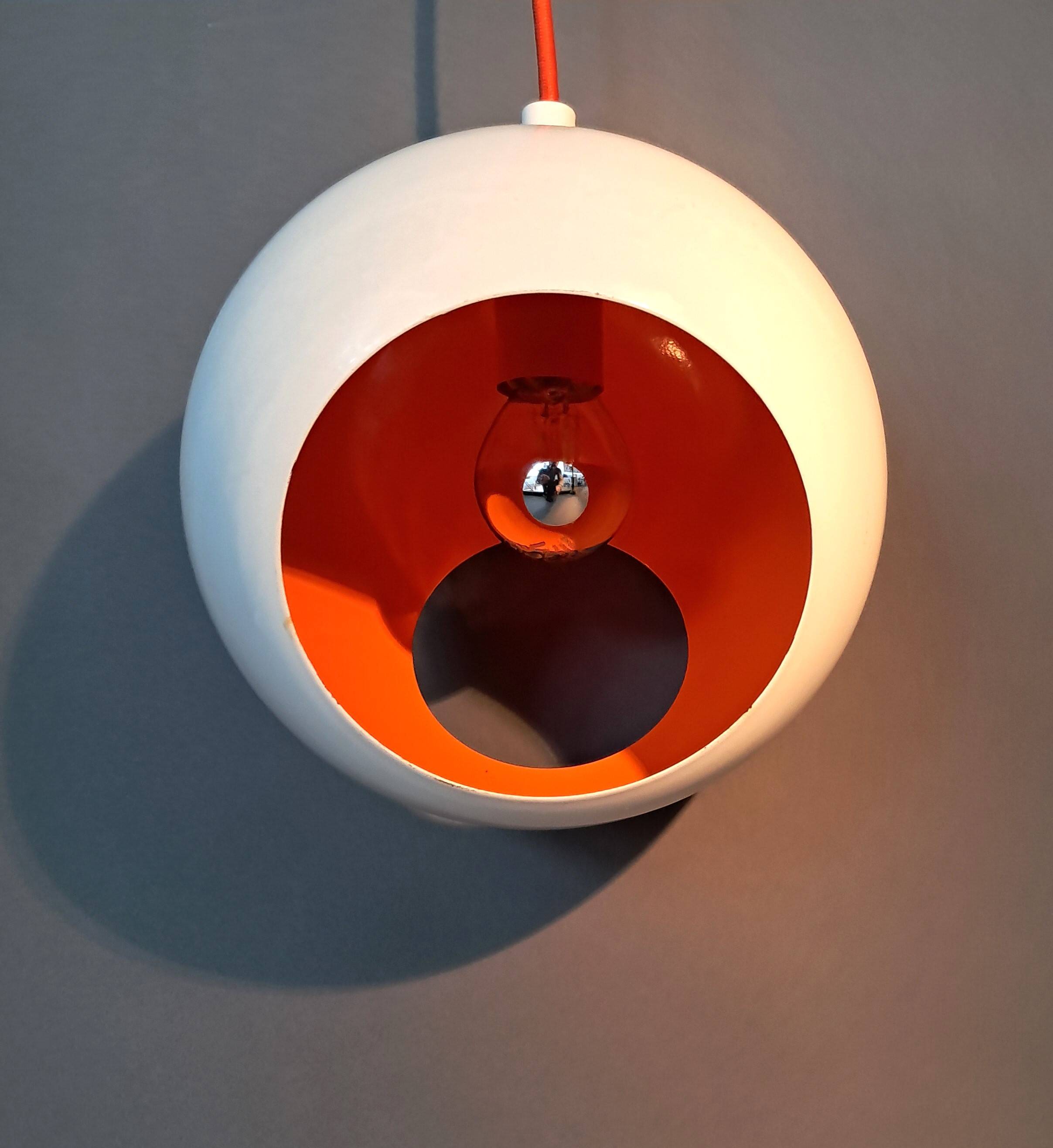 White openwork pendant light with orange interior 1970/1980.