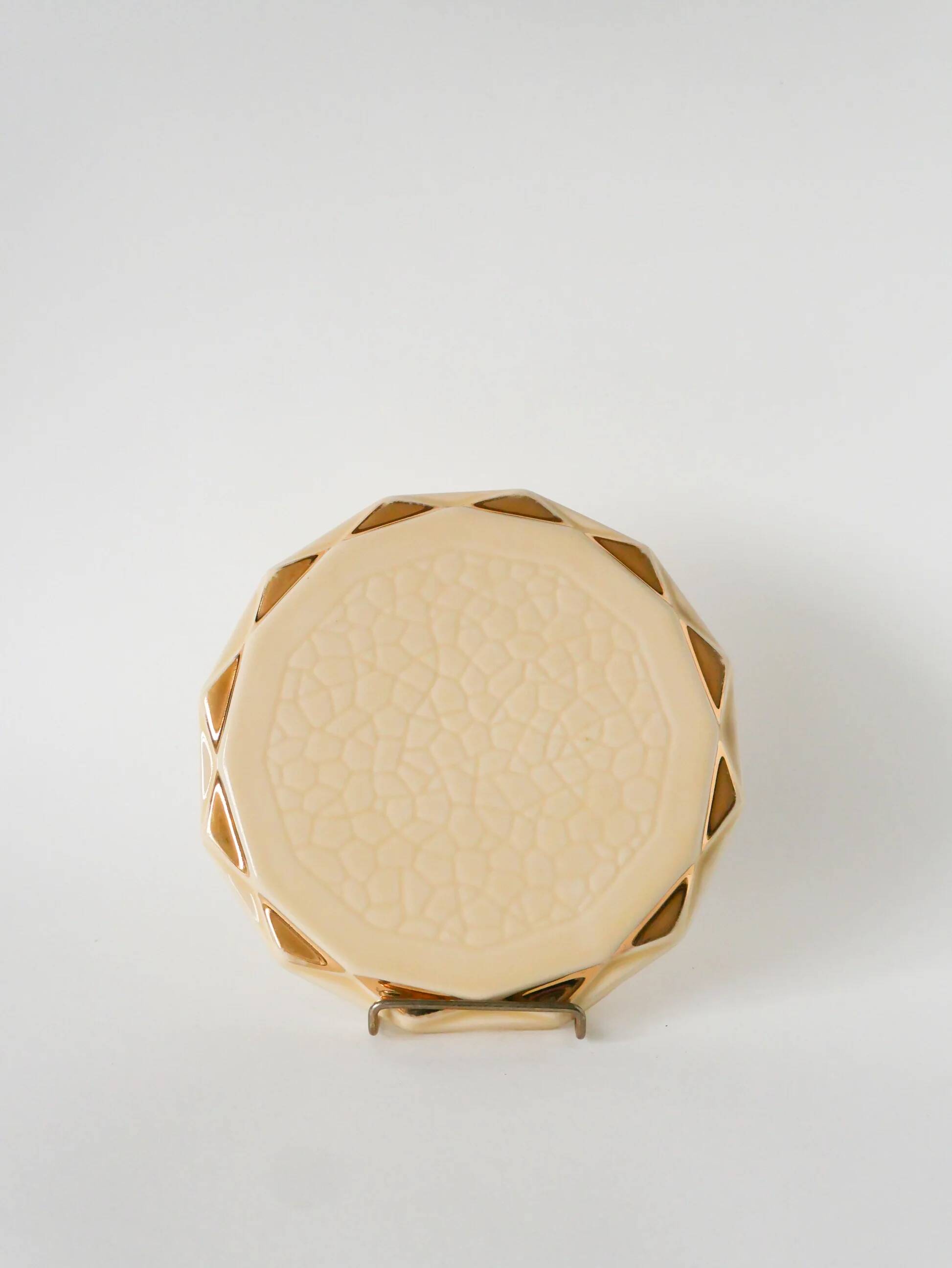 Ceramic trivet, butter yellow and gold, 1960.