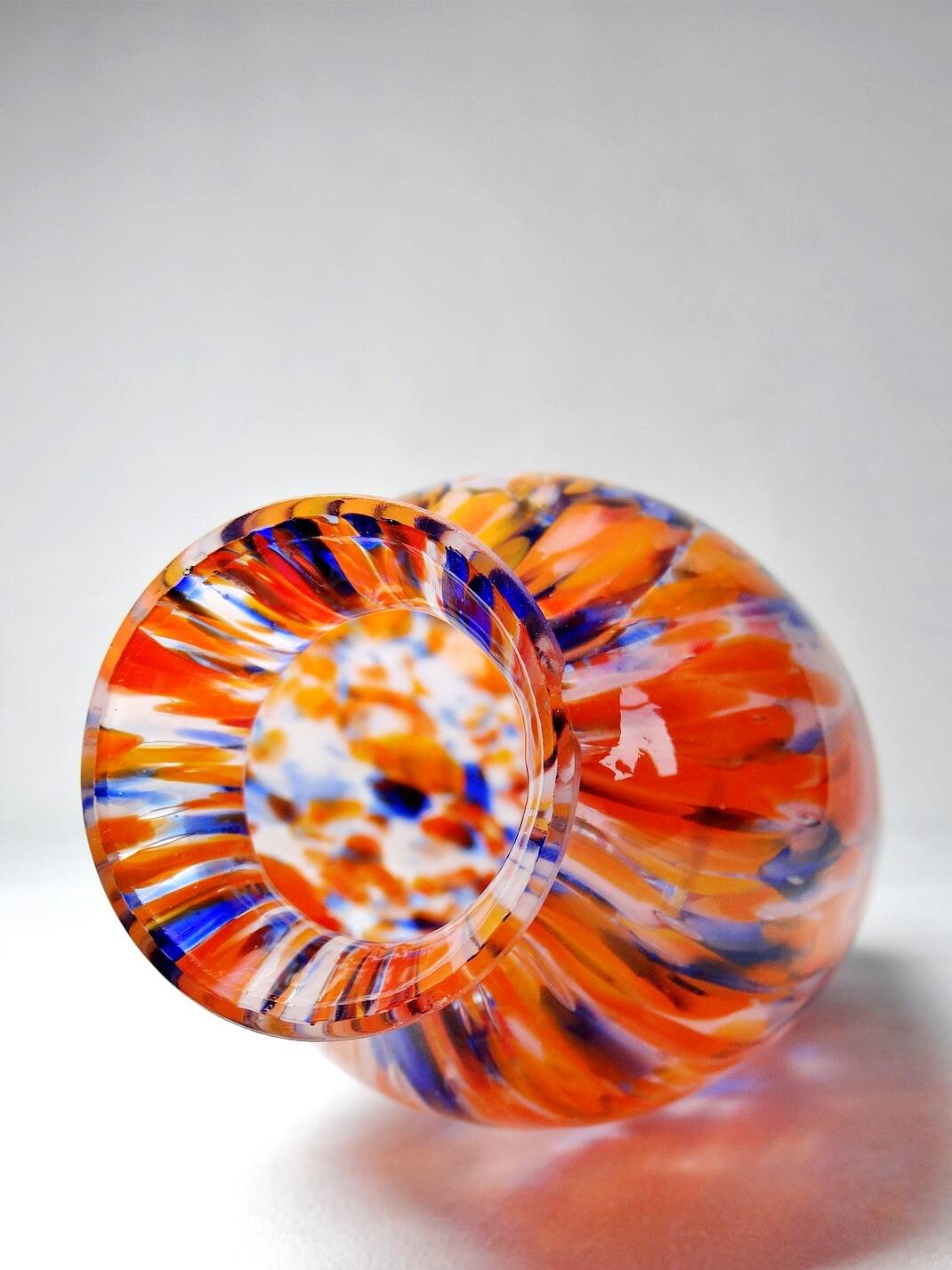 Small antique art deco cobalt orange speckled glass paste vase