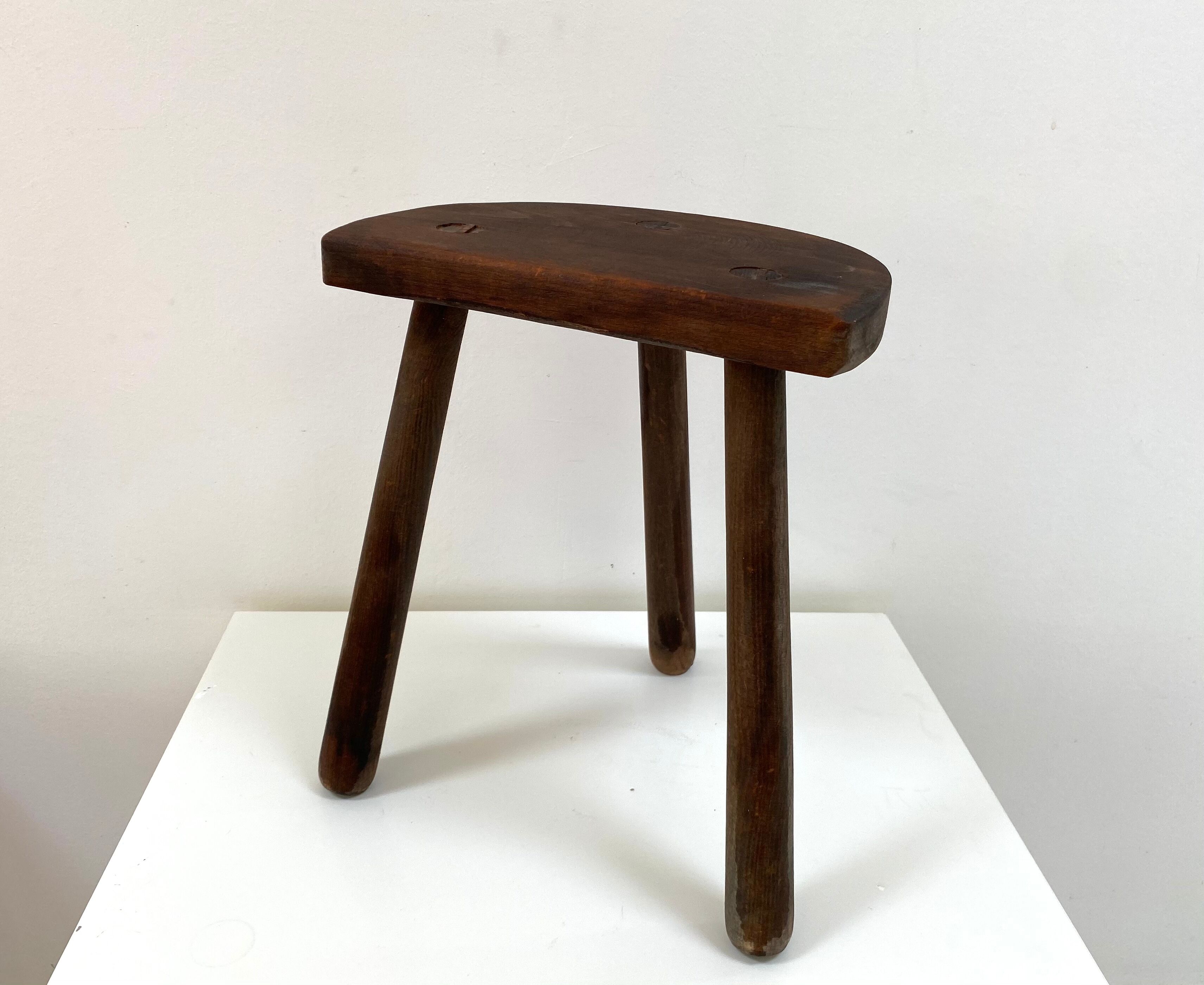 Old wooden tripod stool