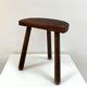 Old wooden tripod stool