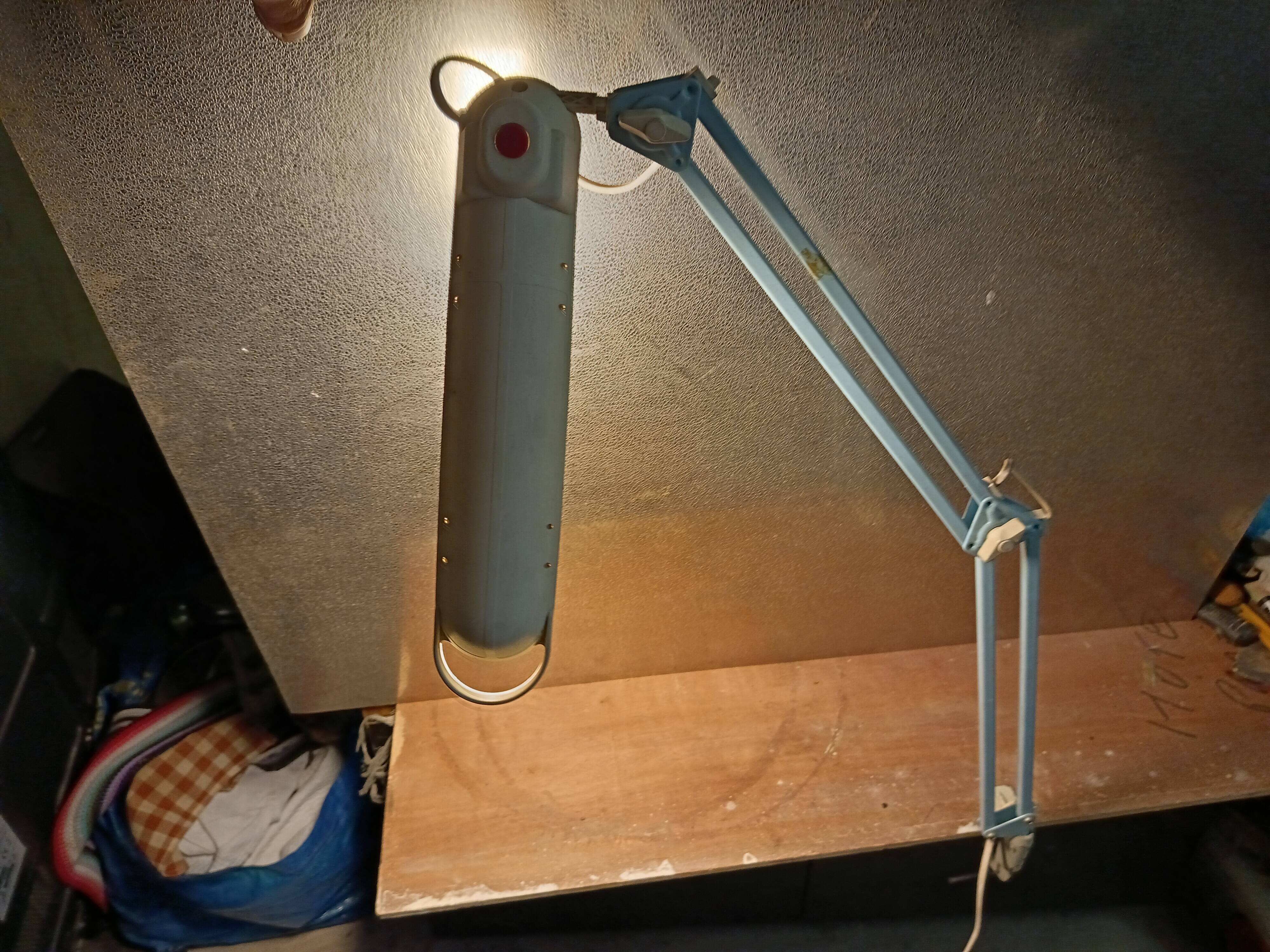 Articulated blue desk lamp