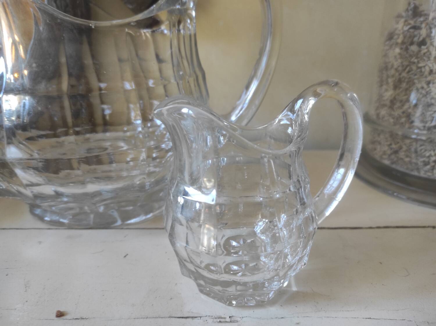 2 antique glass pitchers