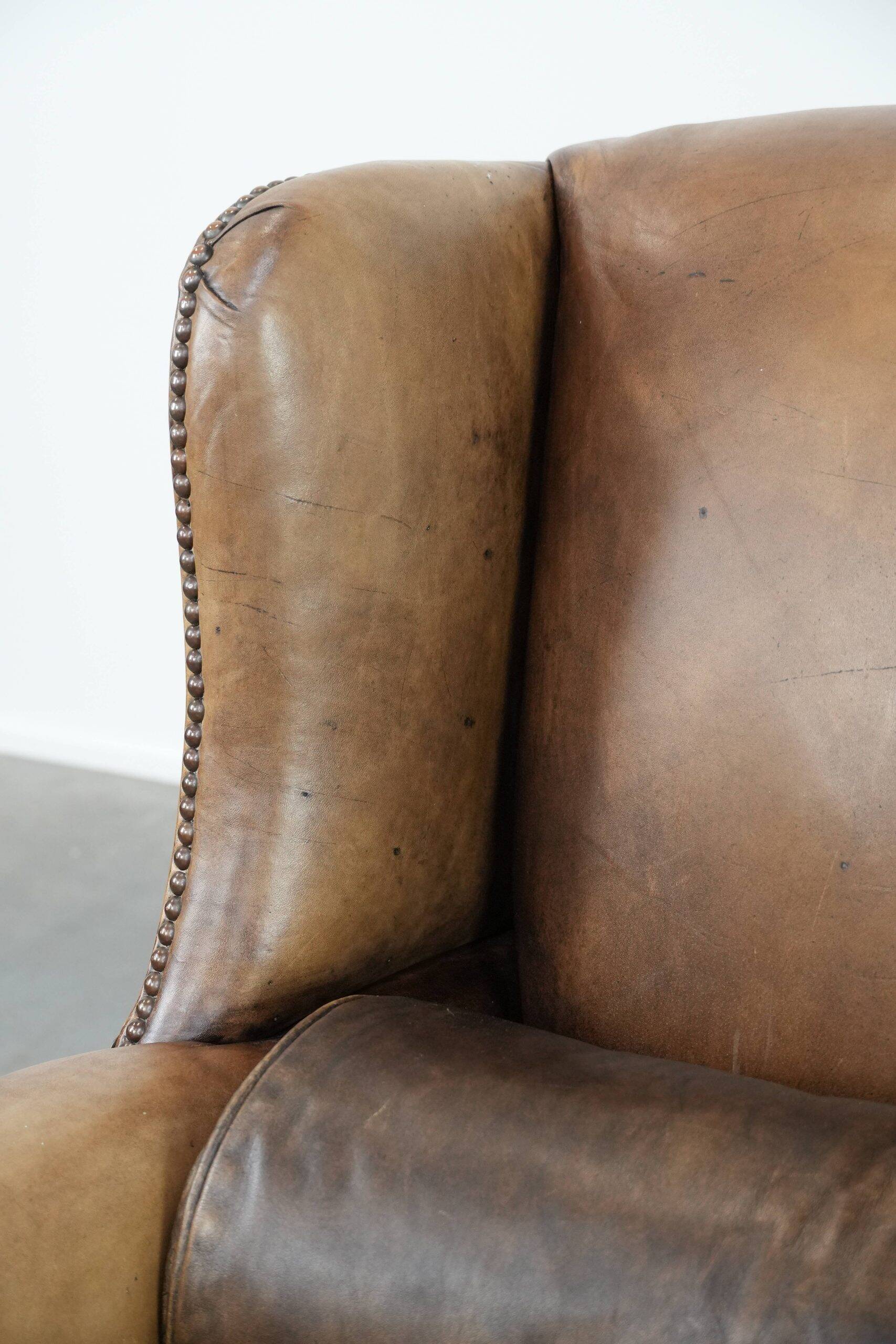 Luxury and large cowhide leather wingback chair in English style