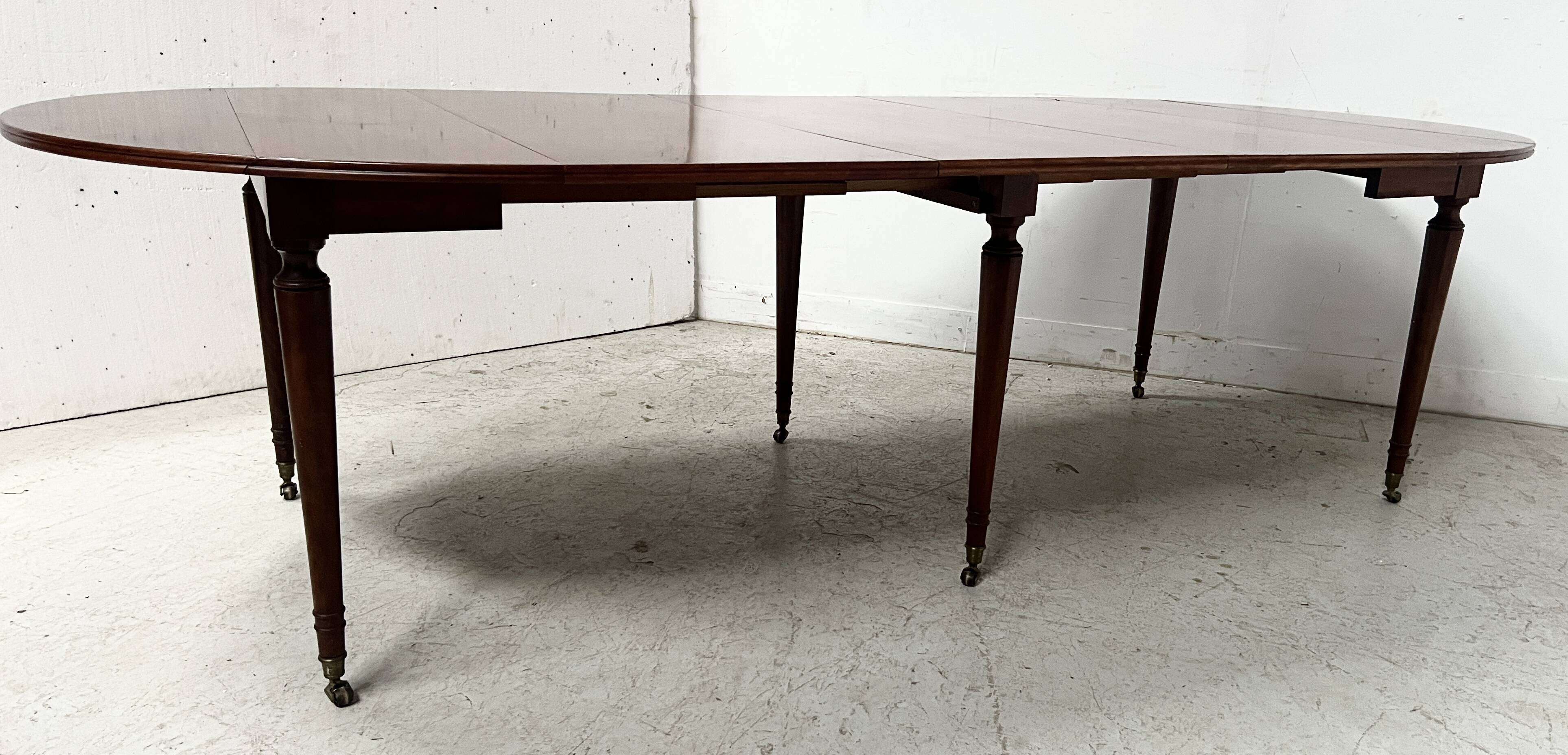 A six-foot Louis XVI style mahogany table from the 19th century.