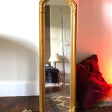 Old slim golden mirror