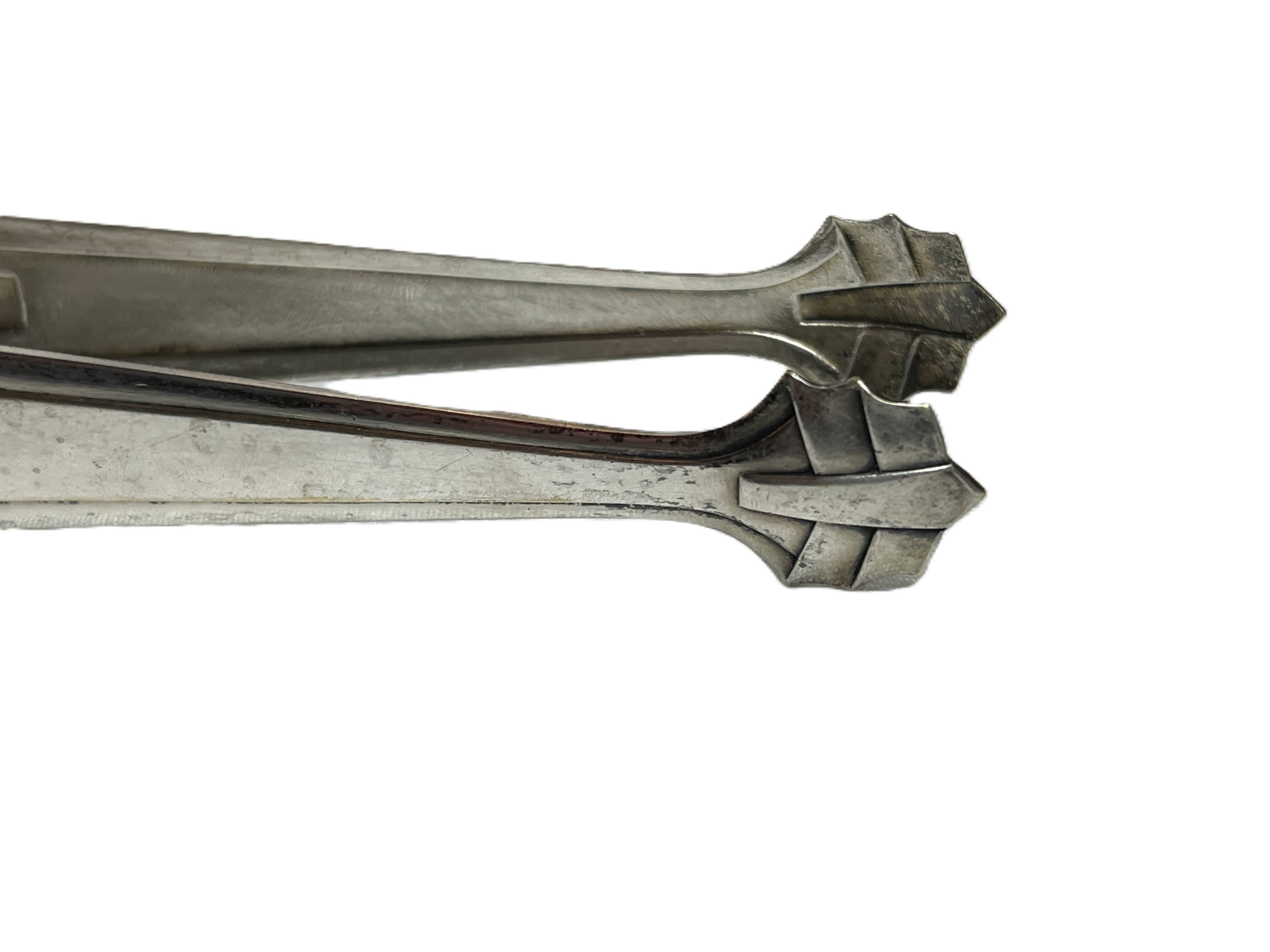 Art Deco, silver-plated sugar tongs from around 1930.