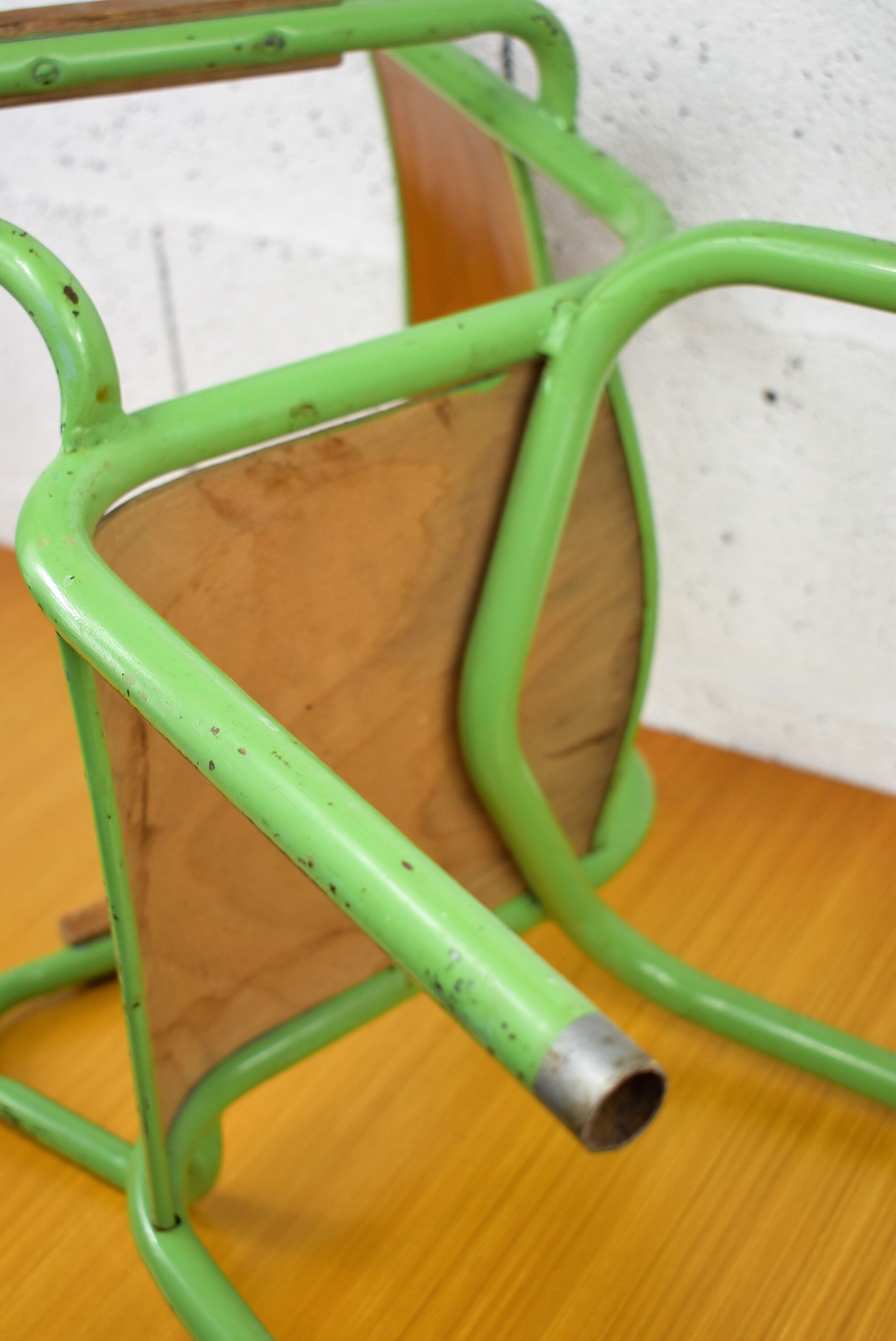 Metal and wood school chair with armrest