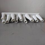 set of decorative vases composed of 11 white ceramic soliflores, evoking the delicate appearance of coral. In good general condition, despite some chips. Dimensions: 29.5 * 5.2 * 11.5 cm.