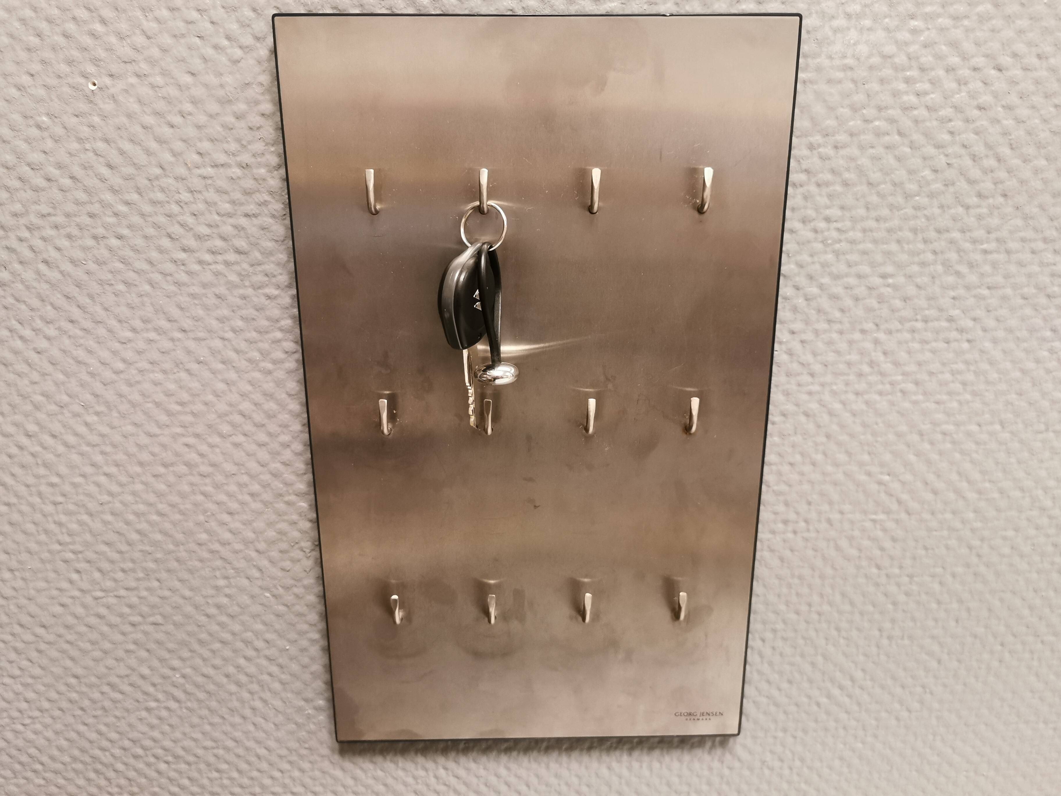George Jensen key hanging board in brushed steel in classic Danish design.