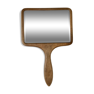 Old beveled hand mirror and wooden frame