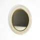 Mid Century Modern round wall mirror with a white expanded metal frame