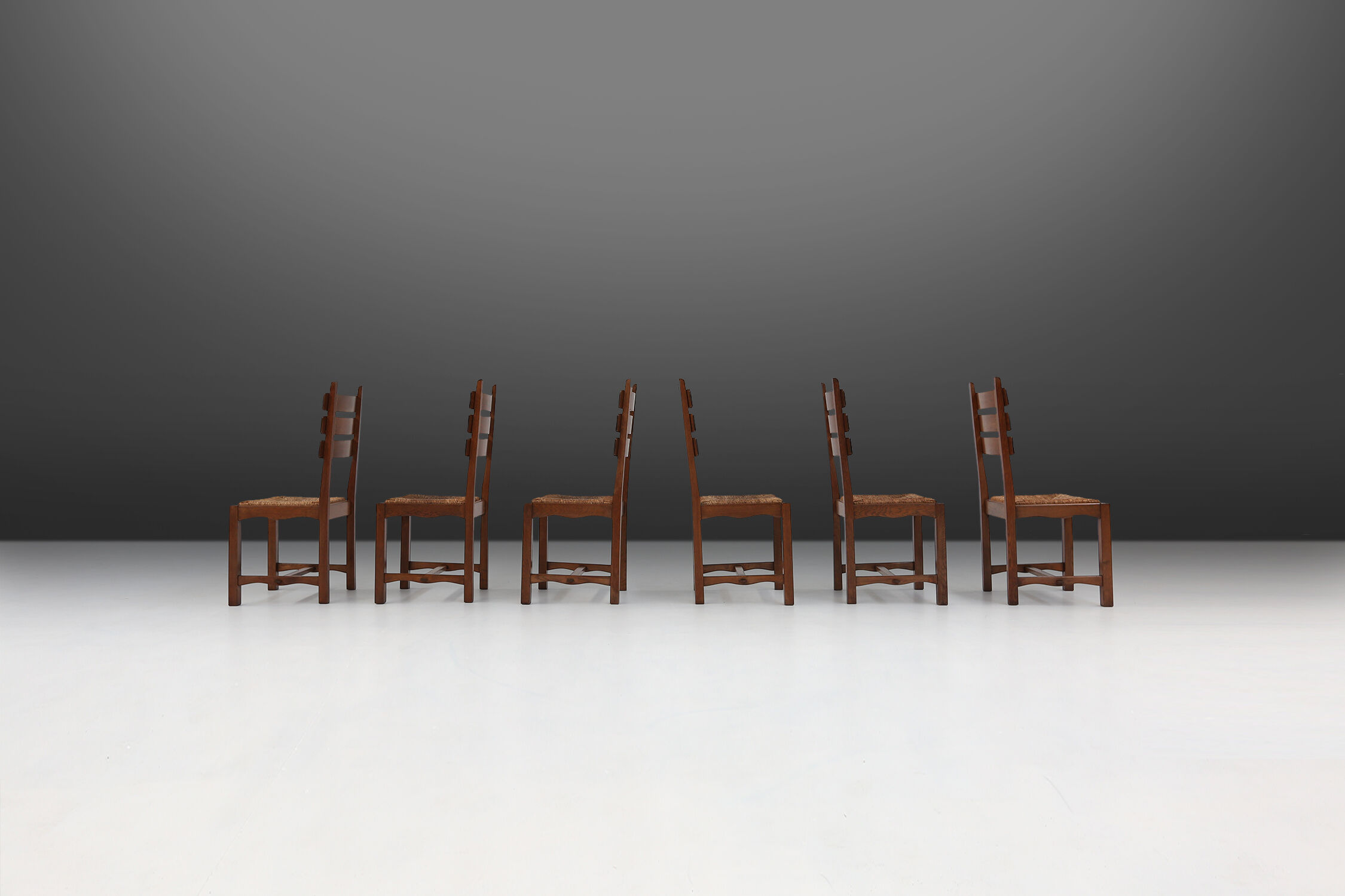 Set of six brutalist dining chairs in oak an wicker