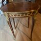 Living room table in Louis XV-Louis XVI transitional style with marquetry and bronze.