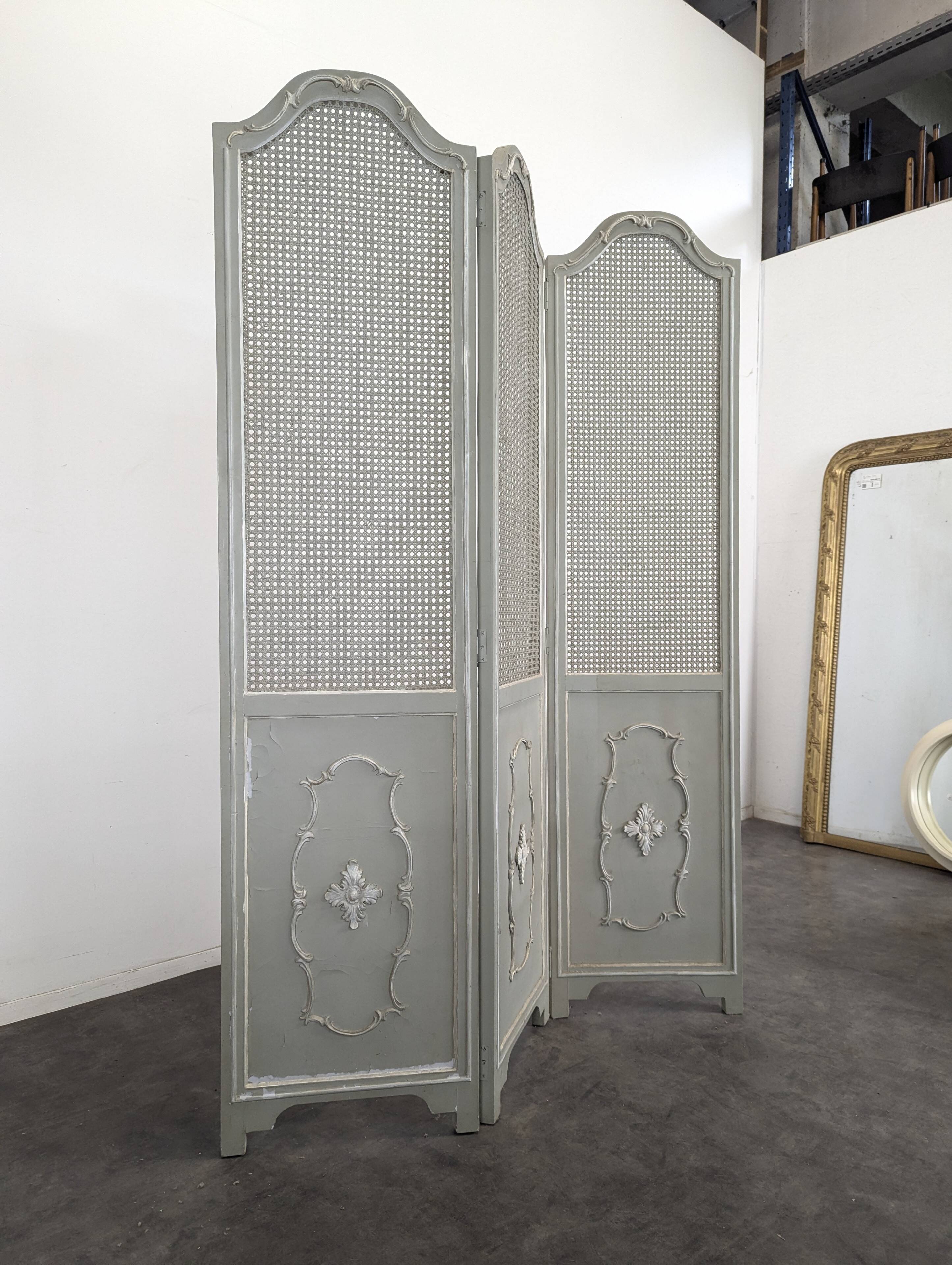 Louis XVI style caned screen with a re-champis finish.