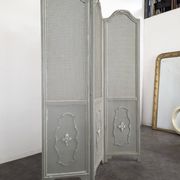 Louis XVI style caned screen with a re-champis finish.