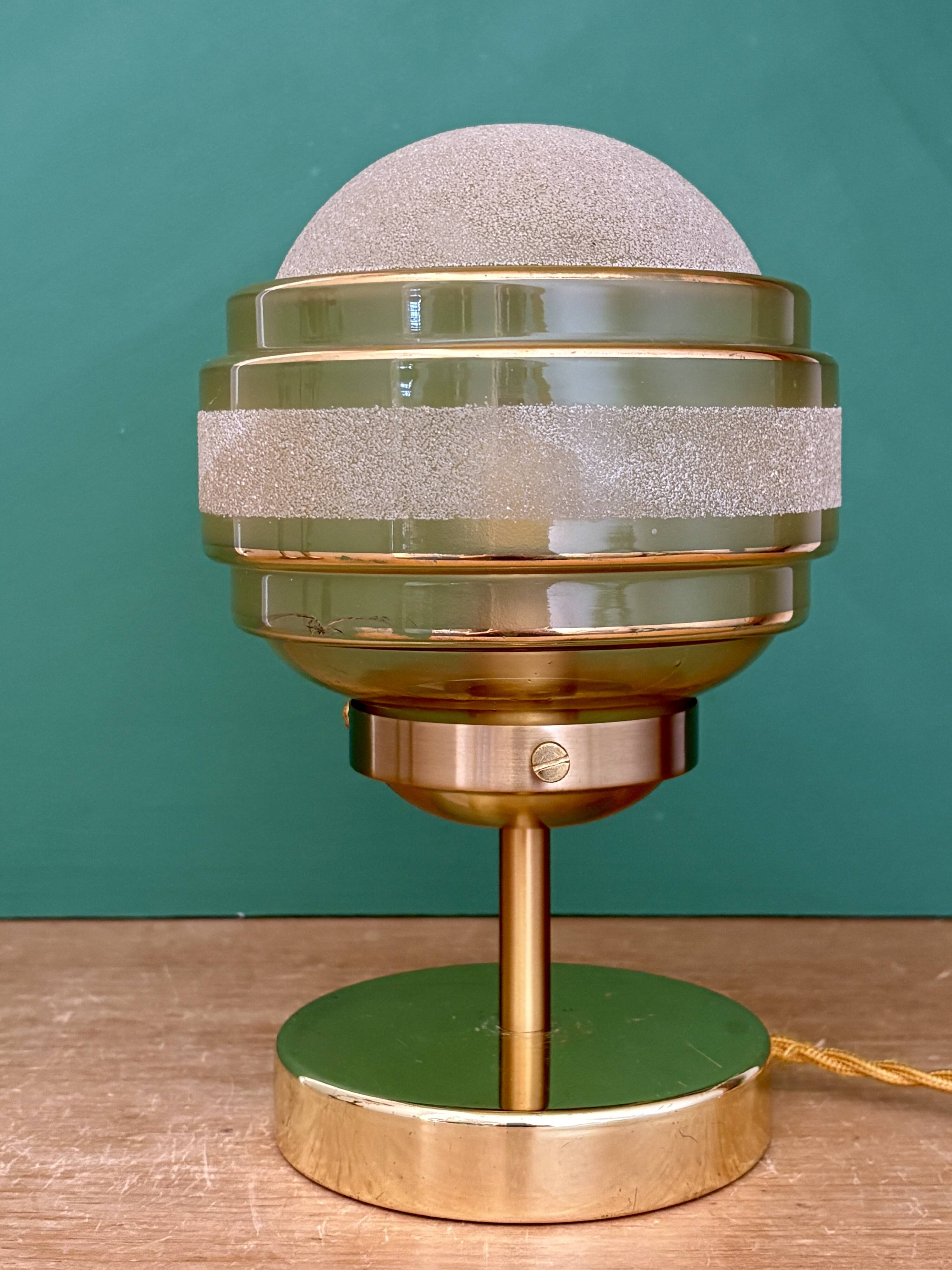 Vintage globe table lamp in frosted yellow and gold glass.