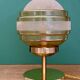 Vintage globe table lamp in frosted yellow and gold glass.