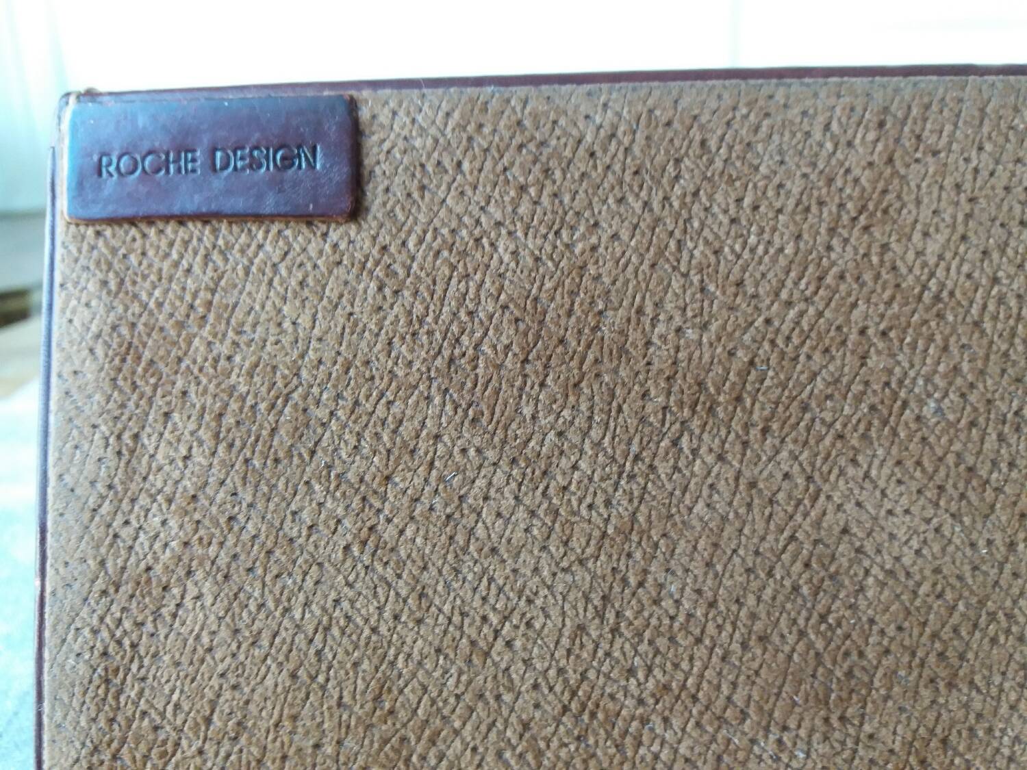 Letter holder covered in leather and golden metal by roche design