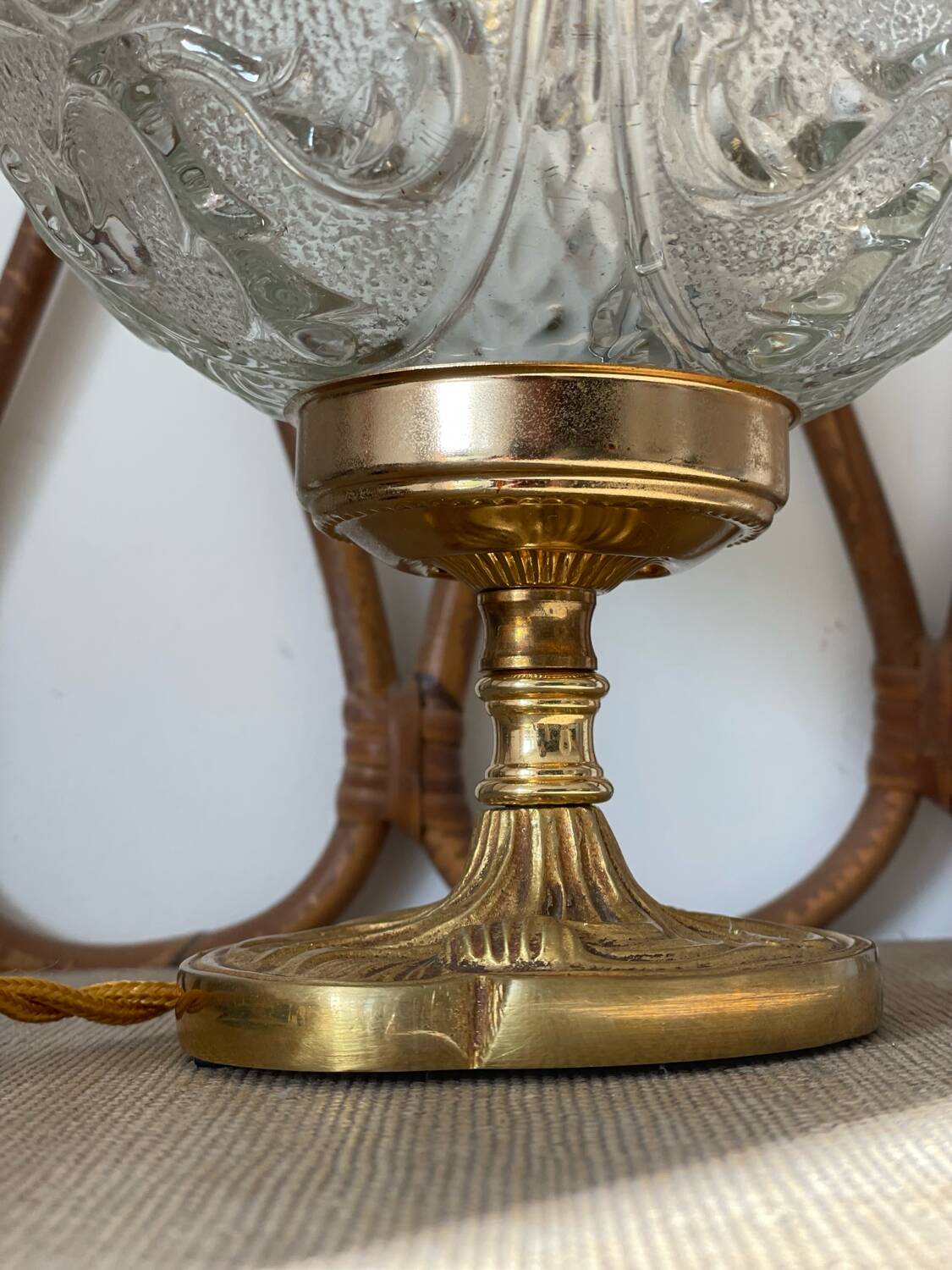Textured round globe table lamp with a gold brass base