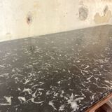 Console inlaid with black marble and lion's paw legs.