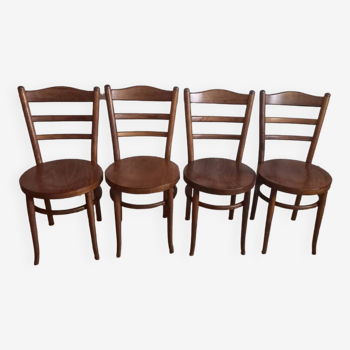 Set of 4 Baumann bistro chairs with round seats.